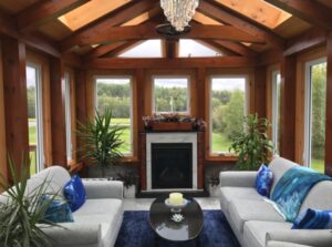 Timber frame sunroom with seating